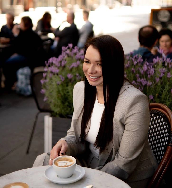 Irina-founder-professional-russian-manicure-courses-photograph-with-coffee